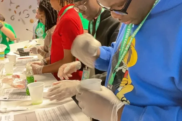 Teacher guiding students through a biology science activity